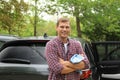 Man with rug near washed car Royalty Free Stock Photo