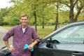 Man with rug near washed car Royalty Free Stock Photo