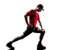 Man runner jogger stretching warming up silhouette Royalty Free Stock Photo