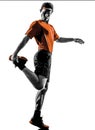 Man runner jogger stretching warming up silhouette Royalty Free Stock Photo