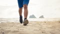 Man runner legs running closeup on shoe, Men jogging on the beach