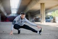 Man runner stretching before training outdoors Royalty Free Stock Photo