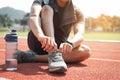 Man runner tying shoelaces on track stadium Royalty Free Stock Photo