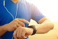 Man running on beach and checking Heart Rate Monitor On watch Royalty Free Stock Photo