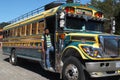 Man on the running board of a bus