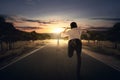 Man running chasing cross at the end of the road Royalty Free Stock Photo