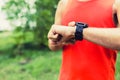 Man running and checking sport smart watch Royalty Free Stock Photo