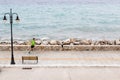 Man running on city street at seaside