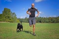 Man running with dog Royalty Free Stock Photo