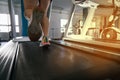 Man running in a gym on a treadmill, concept for exercising, fitness and healthy lifestyle .Treadmill runner at the gym. close-up