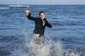 Man running happy on the blue summer beach Royalty Free Stock Photo