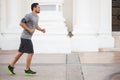 Man running and listening to music outdoors Royalty Free Stock Photo