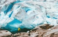 Man running at Nigardsbreen glacier Travel Lifestyle Royalty Free Stock Photo