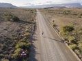 Man running on an open empty road in arid landscape Royalty Free Stock Photo