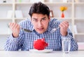 Man running out of money in restaurant and using savings from pi Royalty Free Stock Photo