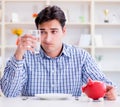 Man running out of money in restaurant and using savings from pi Royalty Free Stock Photo