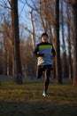 Man running in the park in wintertime