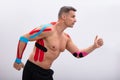 Man Running With Physio Tape On His Body