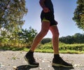 Man running quickly along country lane. Fit and body care Royalty Free Stock Photo