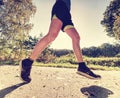 Man running quickly along country lane. Fit and body care Royalty Free Stock Photo