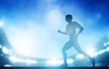 Man running on the stadium in night lights. Athletics run Royalty Free Stock Photo