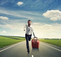 Man running with suitcase on the road