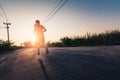 The man are running during the sunrise on the road. the concept of ennergy, activity, healthy, lifestyle and running. Royalty Free Stock Photo