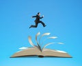 Man running on top of flipping pages of open book