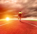 man running on the track with sunrise background Royalty Free Stock Photo