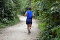 Man running on trail at `Bosque da Freguesia` Public park in the neighborhood of Jacarepagua Royalty Free Stock Photo