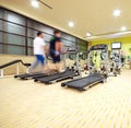 Man running on treadmill in gym Royalty Free Stock Photo