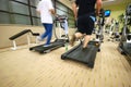 Man running on treadmill in gym Royalty Free Stock Photo