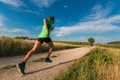 The man running on the unpaved country road