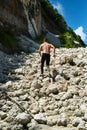 Man Running Up Rocky Hill, Exercising During Outdoor Workout. Sport