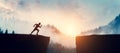 Man running up to jump between cliffs at sunset