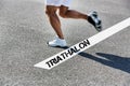 Man running on white line with triathalon sign