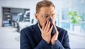 Man with runny nose at office Royalty Free Stock Photo