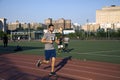 Man runs along jogging track near Yankee Stadium Bronx New York