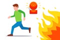 a man runs from the fire. fire siren warns of danger.