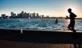 A man runs with the Boston panorama in the background Royalty Free Stock Photo