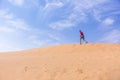 Man runs up the dune in the Wadi Araba desert, Jordan Royalty Free Stock Photo