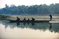 Man runs a wooden boat on the river, Nepal, Chitwan National Park, Royalty Free Stock Photo