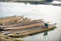 Man runs a wooden boat on the river, Nepal, Chitwan National Park, Royalty Free Stock Photo