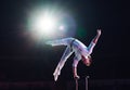 Man`s aerial acrobatics in the Circus ring. Royalty Free Stock Photo