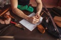 Man`s arms on the working mess table