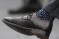 Man`s black leather shoes with socks - male on lecture or business seminar Royalty Free Stock Photo