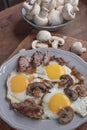 A man `s breakfast, a egg with mushrooms and meat for breakfast - this is a wonderful beginning of the day.