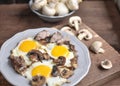 A man `s breakfast, a egg with mushrooms and meat for breakfast - this is a wonderful beginning of the day.