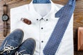 Man`s classic clothes outfit flat lay with formal shirt, tie, shoes and accessories.