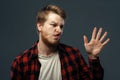 Man`s crazy face crushed on transparent glass